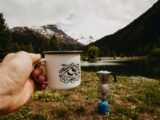 person holding white cup outdoors