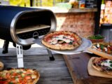 a pizza is being cooked on a grill