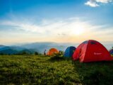 Photo of Pitched Dome Tents Overlooking Mountain Ranges